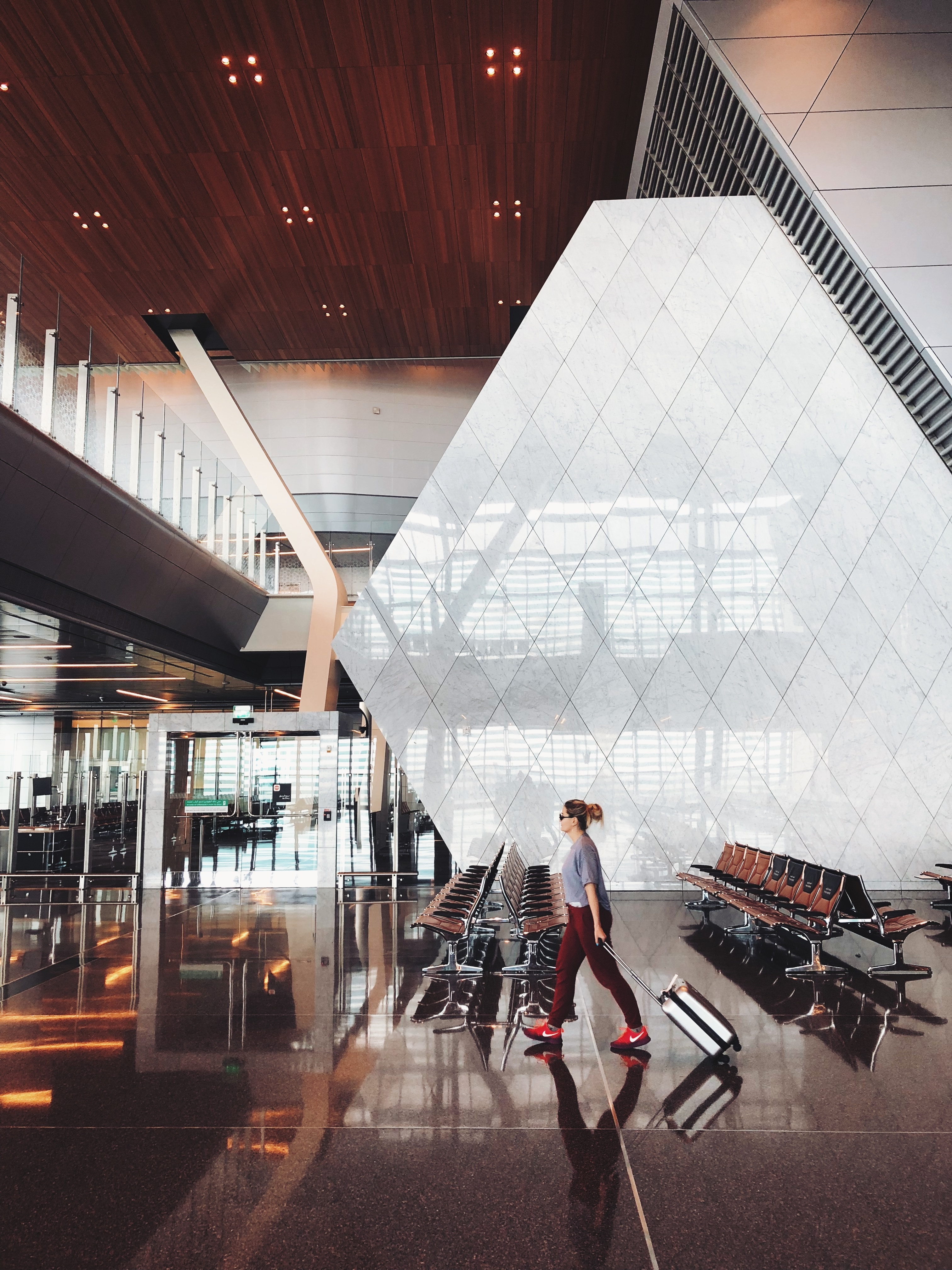 Girl walking through airport.